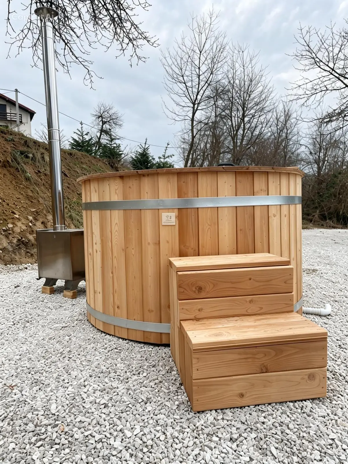 Wood-fired hot tub — wooden thermal tub in thermally treated timber, built by AURATHERM